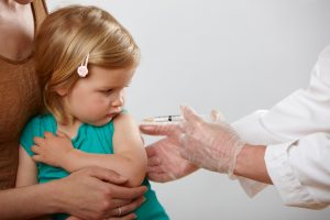 Little girl having an injection